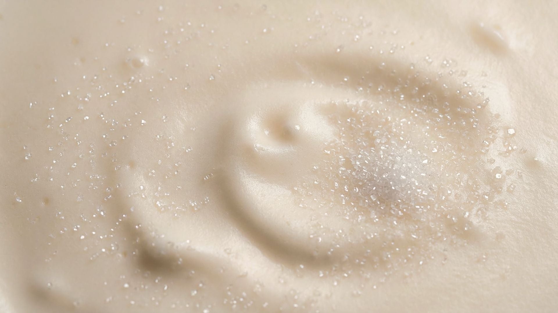 Close-up of a creamy texture of Crema Catalan with sugar crystals 